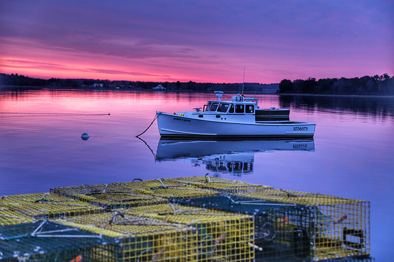 Boat Anchored at Dock at Night